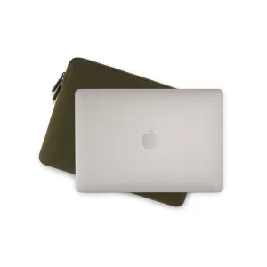 Pipetto dark green MacBook sleeve with zip closure, shown beside a silver MacBook on a white background