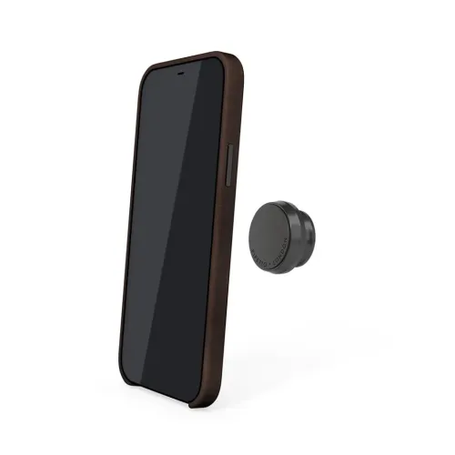 Das magnetische Leder-Case für iPhone 12/12 Pro ist seitlich am Smartphone mit schlankem Profil zu sehen, neben einer runden magnetischen Befestigungsplatte.